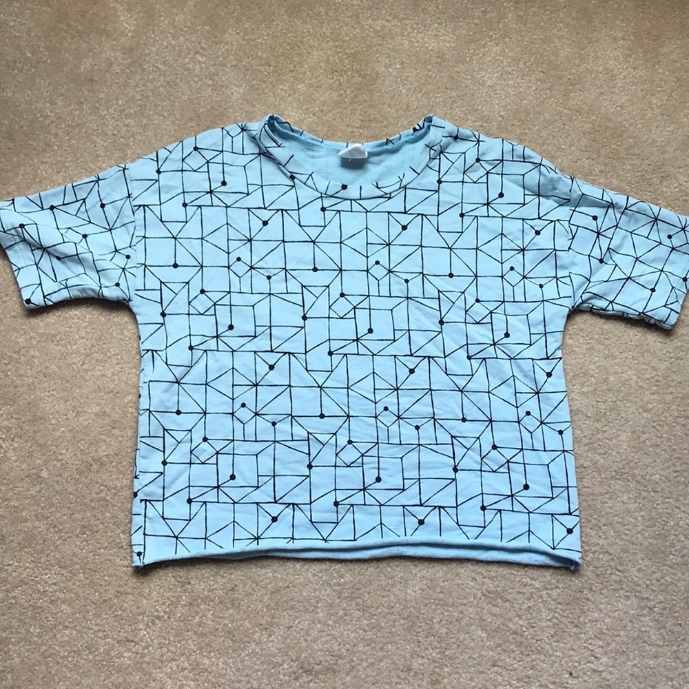 Black and blue cropped shirt.